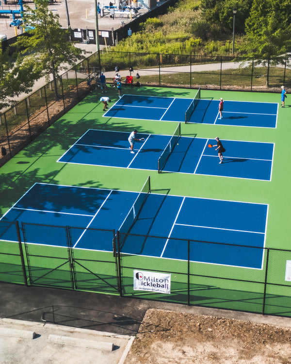 Public pickleball facility featuring EIGHTYNINE Sports pickleball posts and nets.
