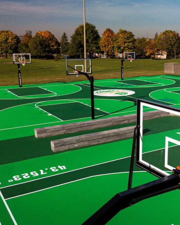 Eight CITY HOOPS Gooseneck+ basketball systems installed at the Giants of Africa public basketball court.