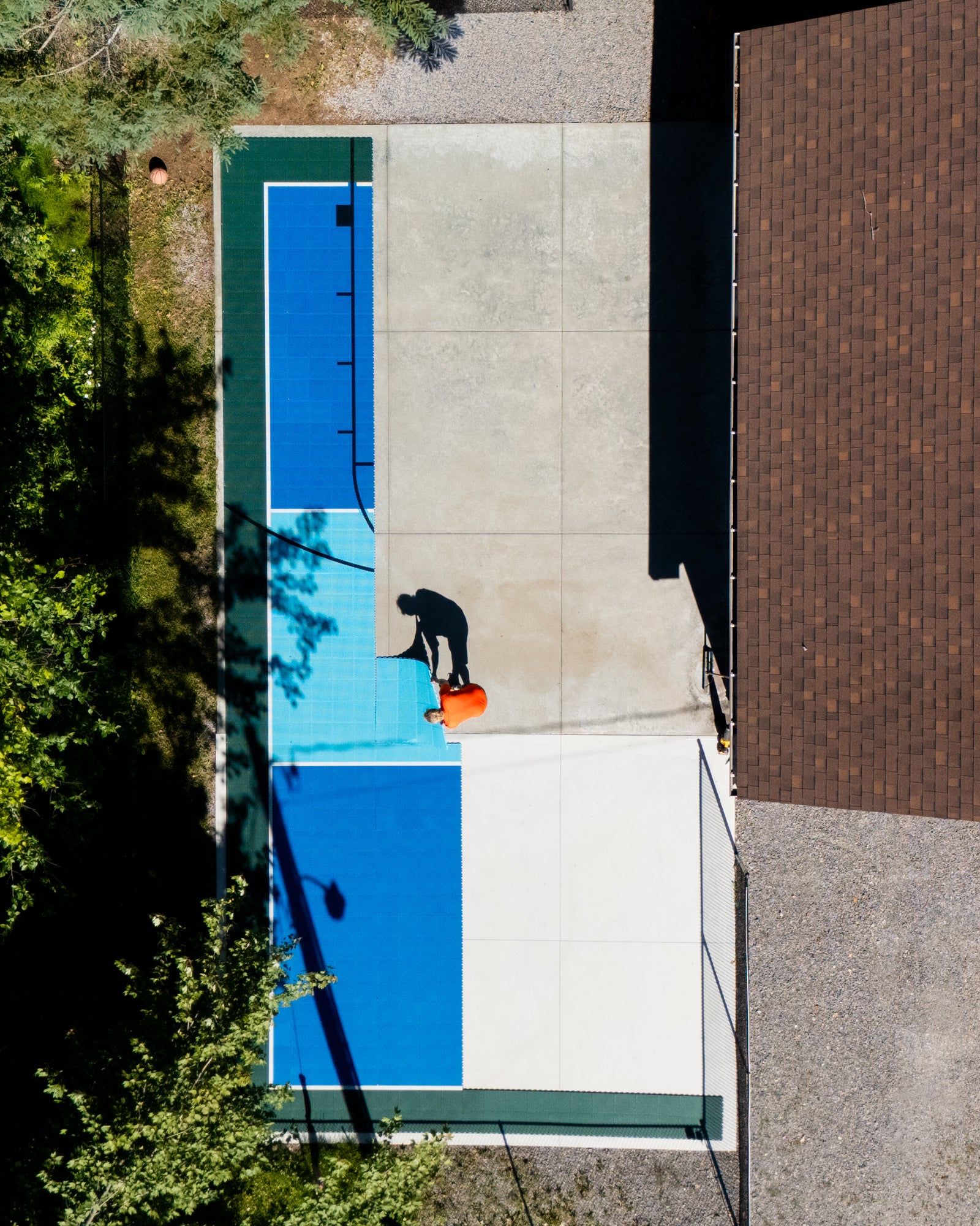 A top down view of hexpro sport tiles by eightynine sports being assembled on a concrete slab pad