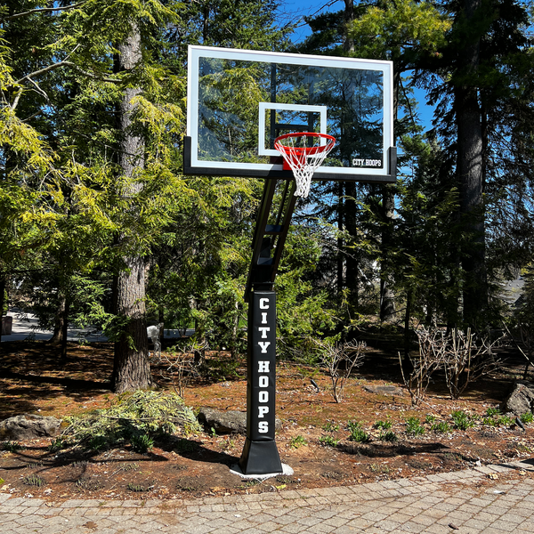 CITY HOOPS Platinum basketball system installed on a residential driveway.