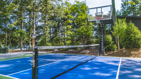 CITY HOOPS Platinum basketball system integrated into a pickleball court.