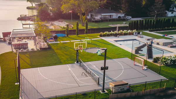 CITY HOOPS Platinum basketball system installed on a lakefront multi-use court.
